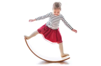 girl balancing on balance board